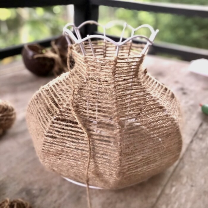 In-progress shot of an upcycled lamp being made using natural, sustainable jute materials